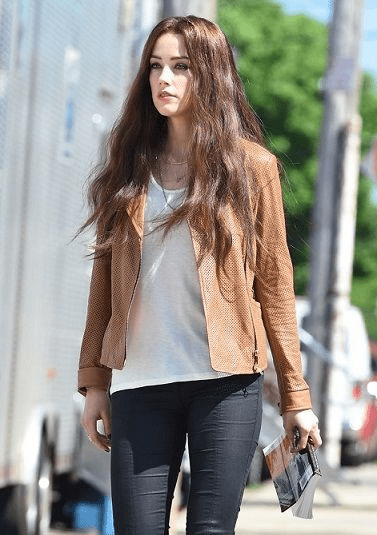 amber heard looking like a doll with brown jacket and long hairs