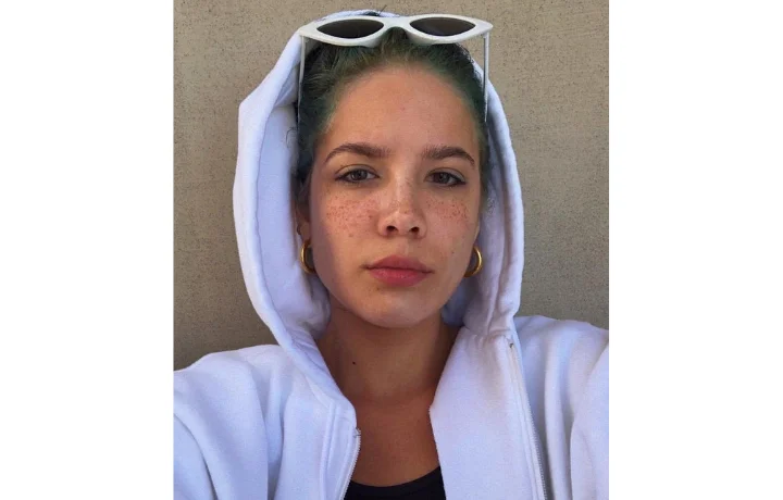 Halsey in a hoodie and cool glasses 