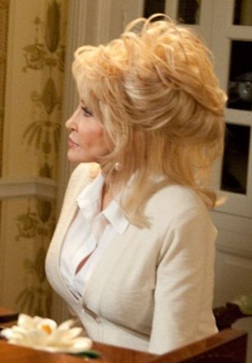 dolly parton wearing a suit and in minimal makeup